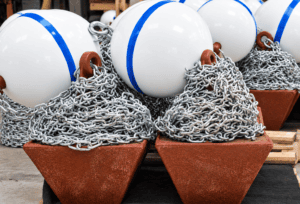 Pyramid anchor kit for securing turbidity curtains, containment booms, floating barriers, and marine environmental control systems.